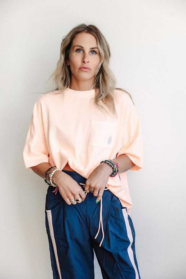 arlo-free-people-movement-logo-tackle-tee-pastel-peach